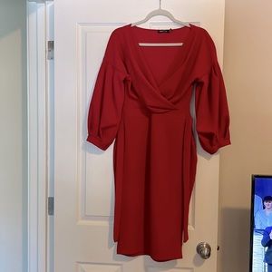 Below knee. Size 14z stretchy material. Ties in back. Shows off hourglass form.